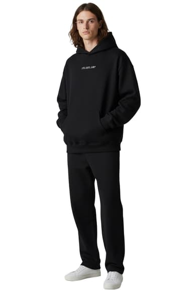 Model wearing the ATLASFLAME 400gsm hoodie in a minimal, oversized fit