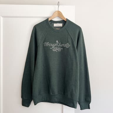 dark forest green sweatshirt with white embroidery